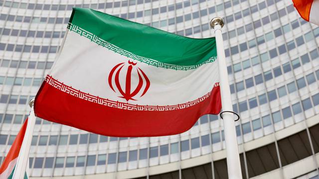 FILE PHOTO: The Iranian flag waves in front of the International Atomic Energy Agency (IAEA) headquarters in Vienna