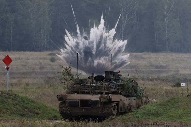 Polish forces with NATO soldiers hold military exercises 'Iron Defender' at Orzysz training ground in Wierzbiny