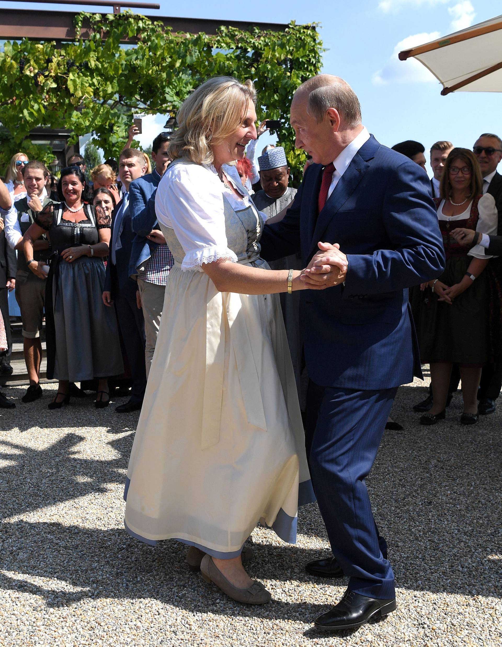 Austria's Foreign Minister Kneissl dances with Russia's President Putin at her wedding in Gamlitz