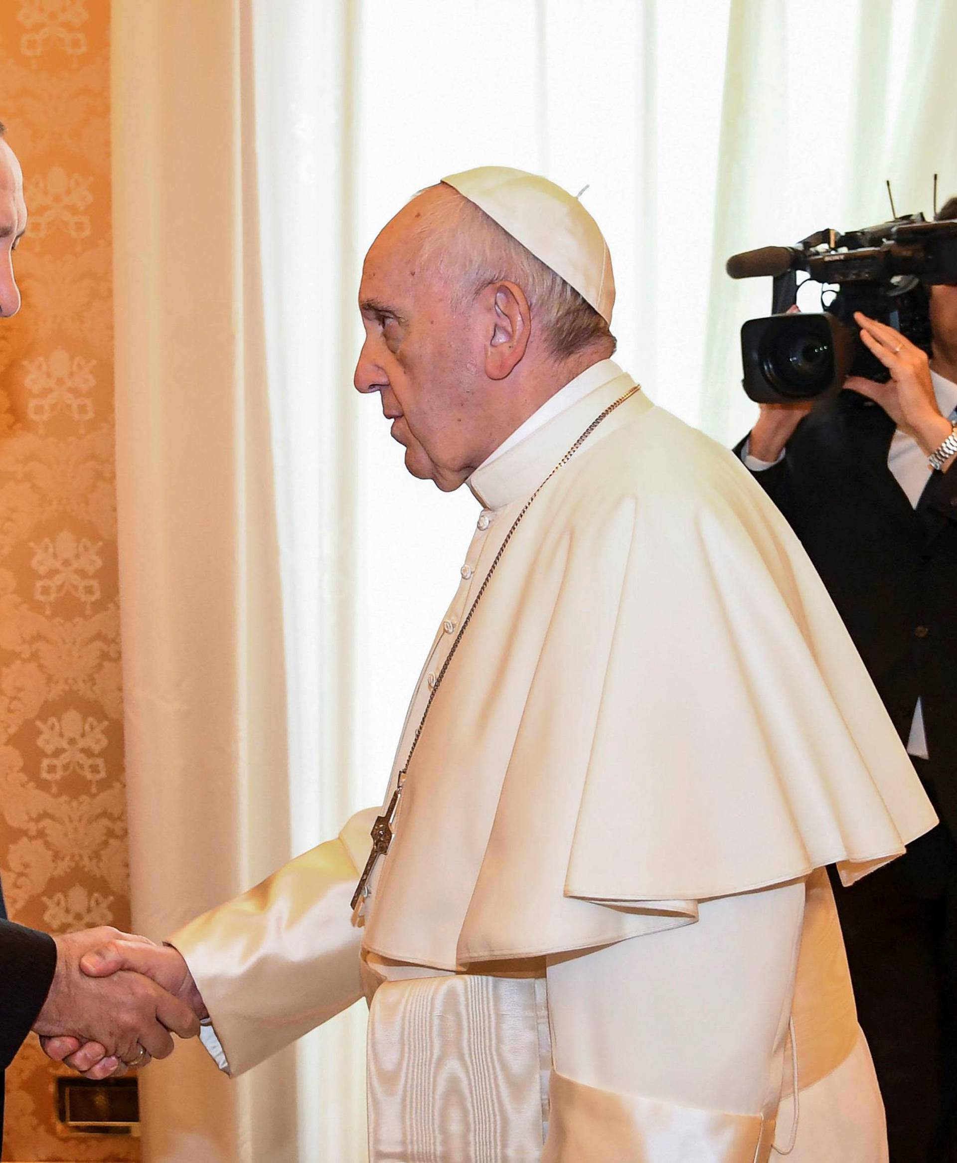 Pope Francis welcomes Turkish President Tayyip Erdogan during a private audience at the Vatican