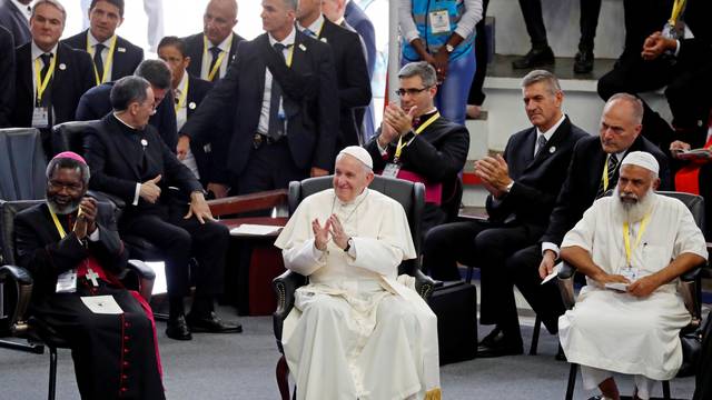 Pope Francis reacts during an interreligious meeting at Maxaquene Pavilion in Maputo