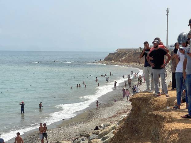 Migrants cross on foot into North African enclave of Ceuta from Morocco