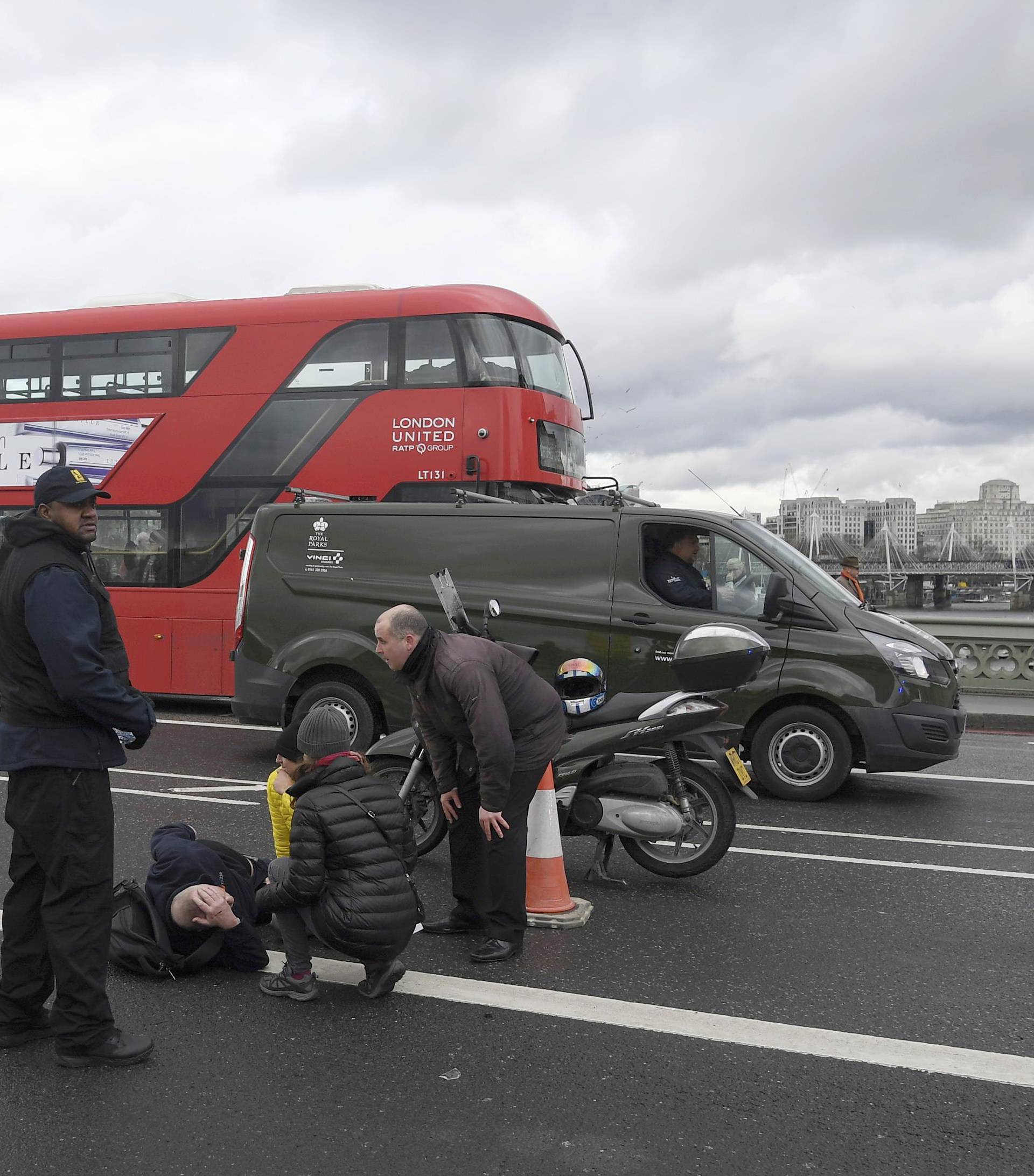 A man lies injured after a shottingt incident on Westminster Bridge in London