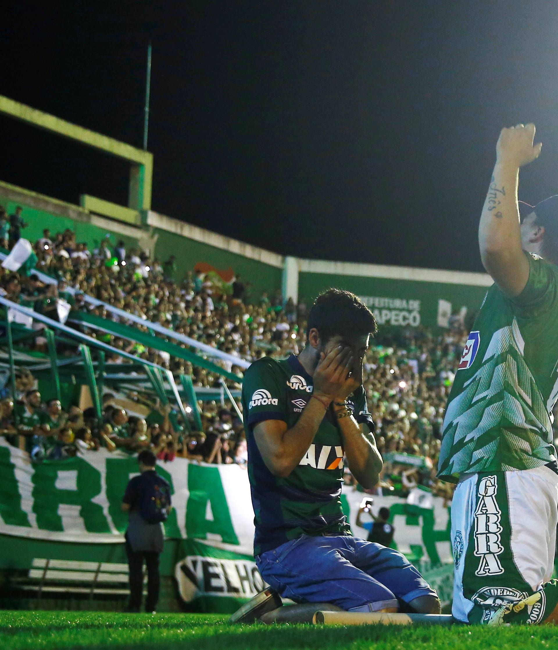 Fans of Chapecoense soccer team pay tribute to Chapecoense's players at the Arena Conda stadium in Chapeco