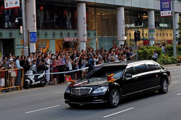 The vehicle carrying North Korean leader Kim Jong Un makes its way to the Istana in Singapore