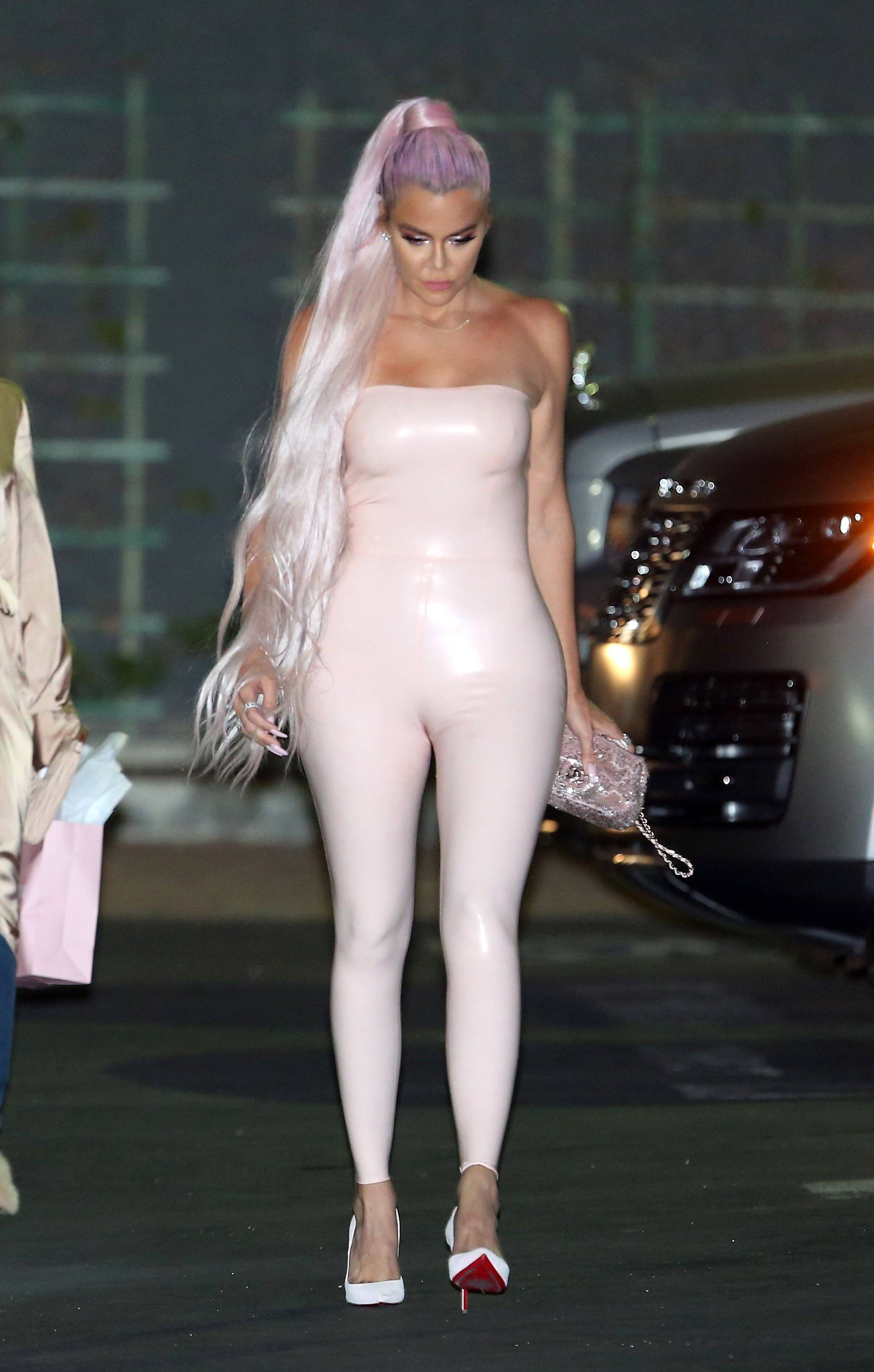 KhloÃ© Kardashian wears a tight pink leather dress as she leaves Goya Studios