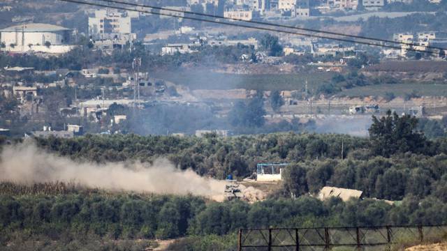 An Israeli tank manoeuvres in Gaza, as seen from southern Israel