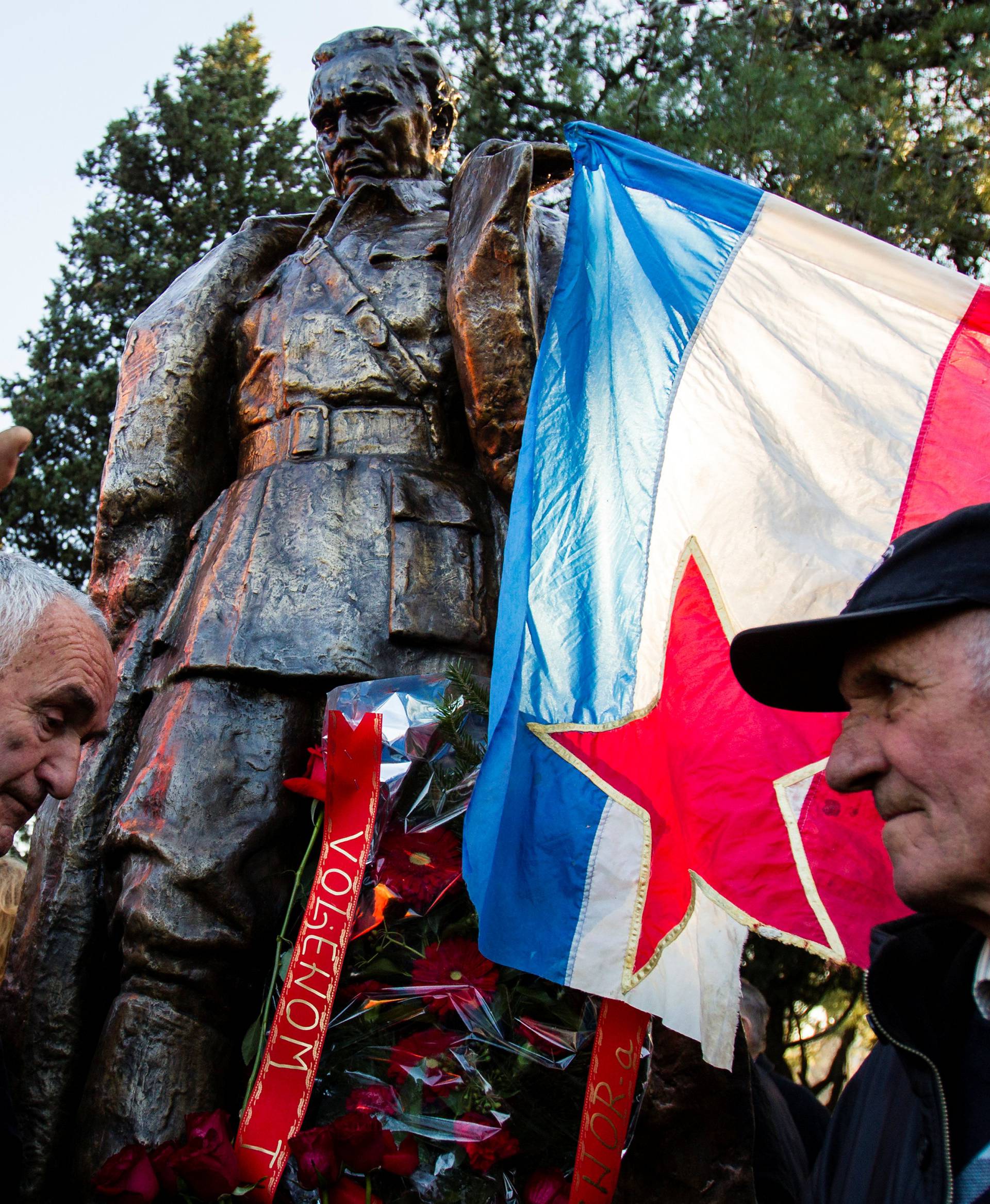 People crowd for a picture at the monument of late Yugoslav leader Josip Broz Tito after unveiling ceremony in Podgorica