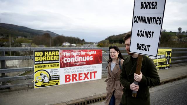 FILE PHOTO: People attend a protest against Brexit at the border crossing between the Republic of Ireland and Northern Ireland in Carrickcarnon