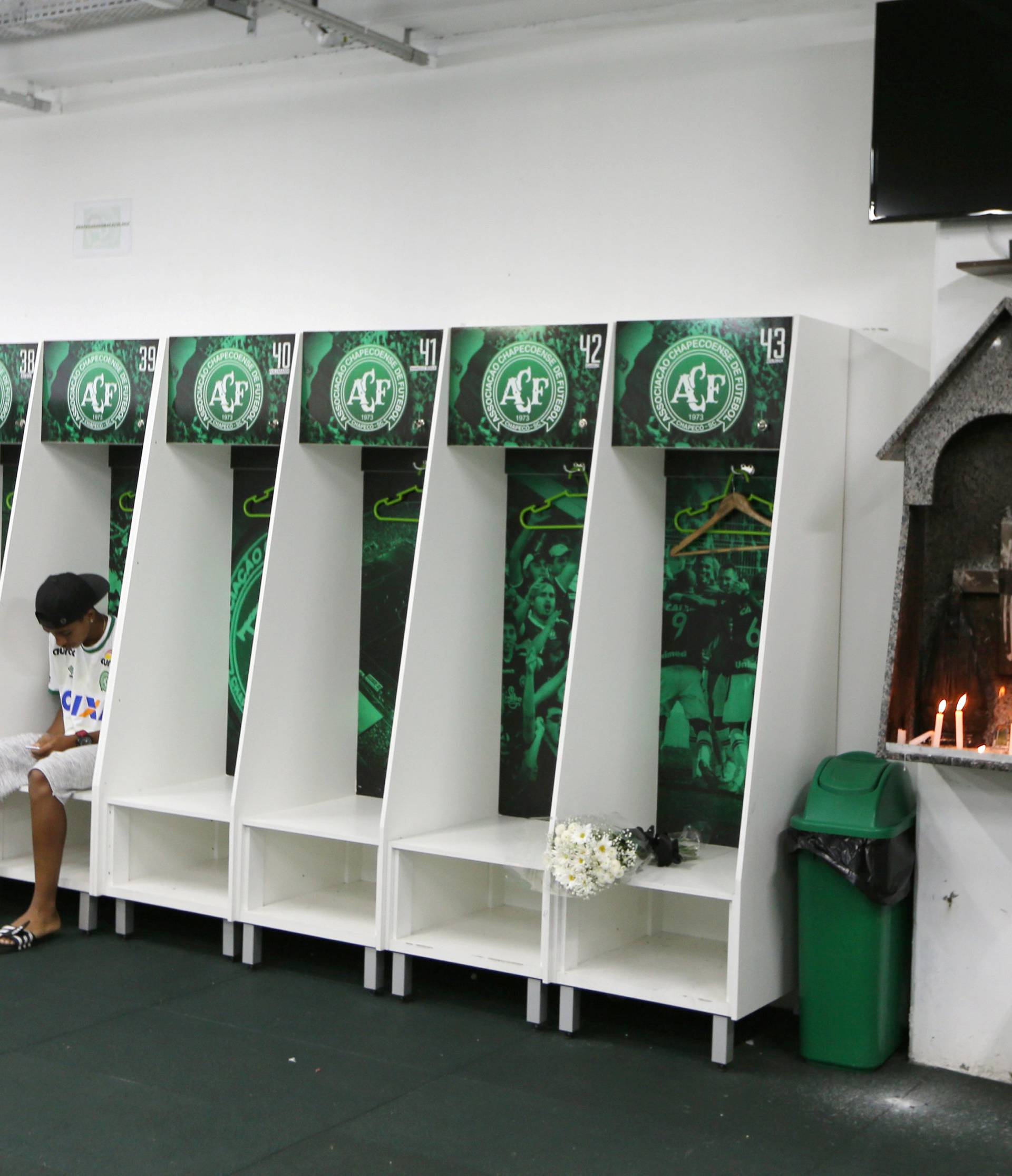 Leandro Bastos player of Chapecoense's under-15 soccer team sits inside the team's locker room at the Arena Conda stadium in Chapeco