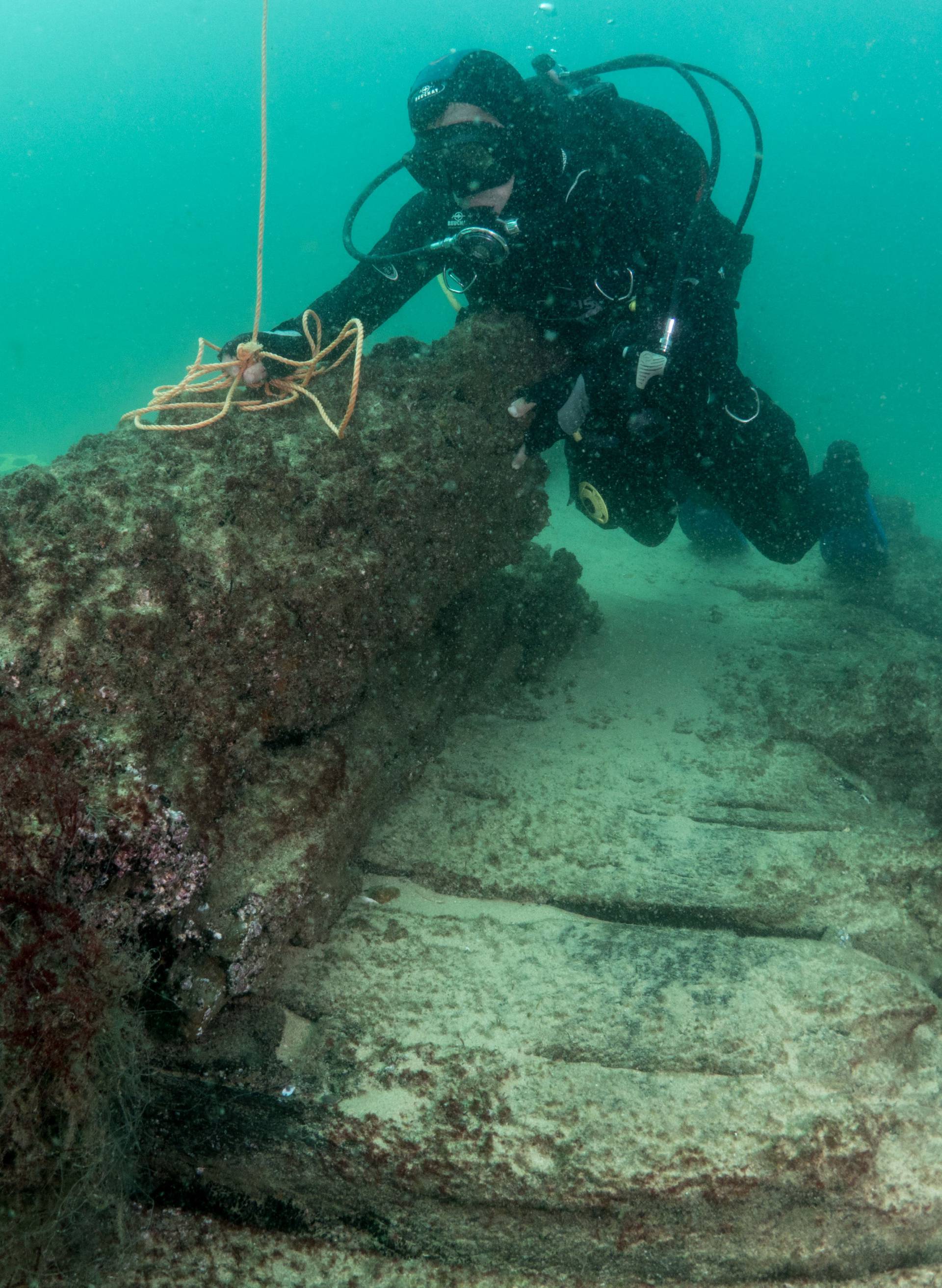 Divers are seen during the discovery of a centuries-old shipwreck, in Cascais