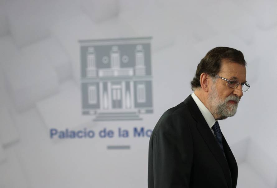 Spain's PM Rajoy arrives to deliver a statement at the Moncloa Palace in Madrid