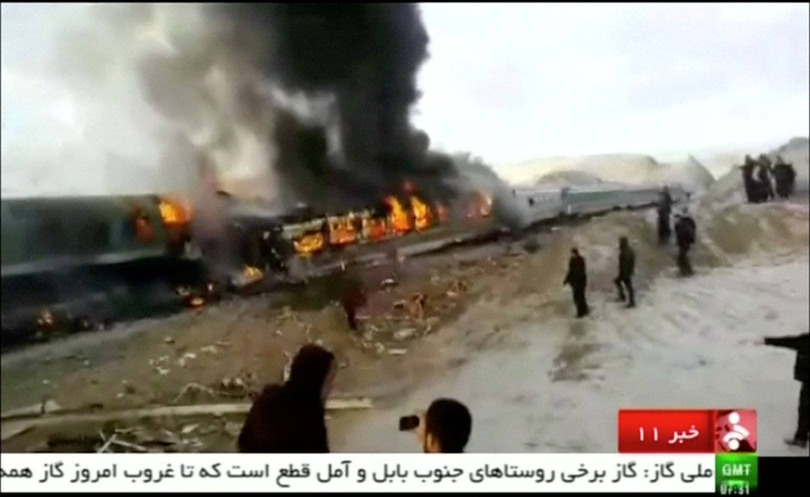 Still frame taken from video show people gathering around two passenger trains that collided in the city of Shahroud, in the north-central province of Semnan, Iran