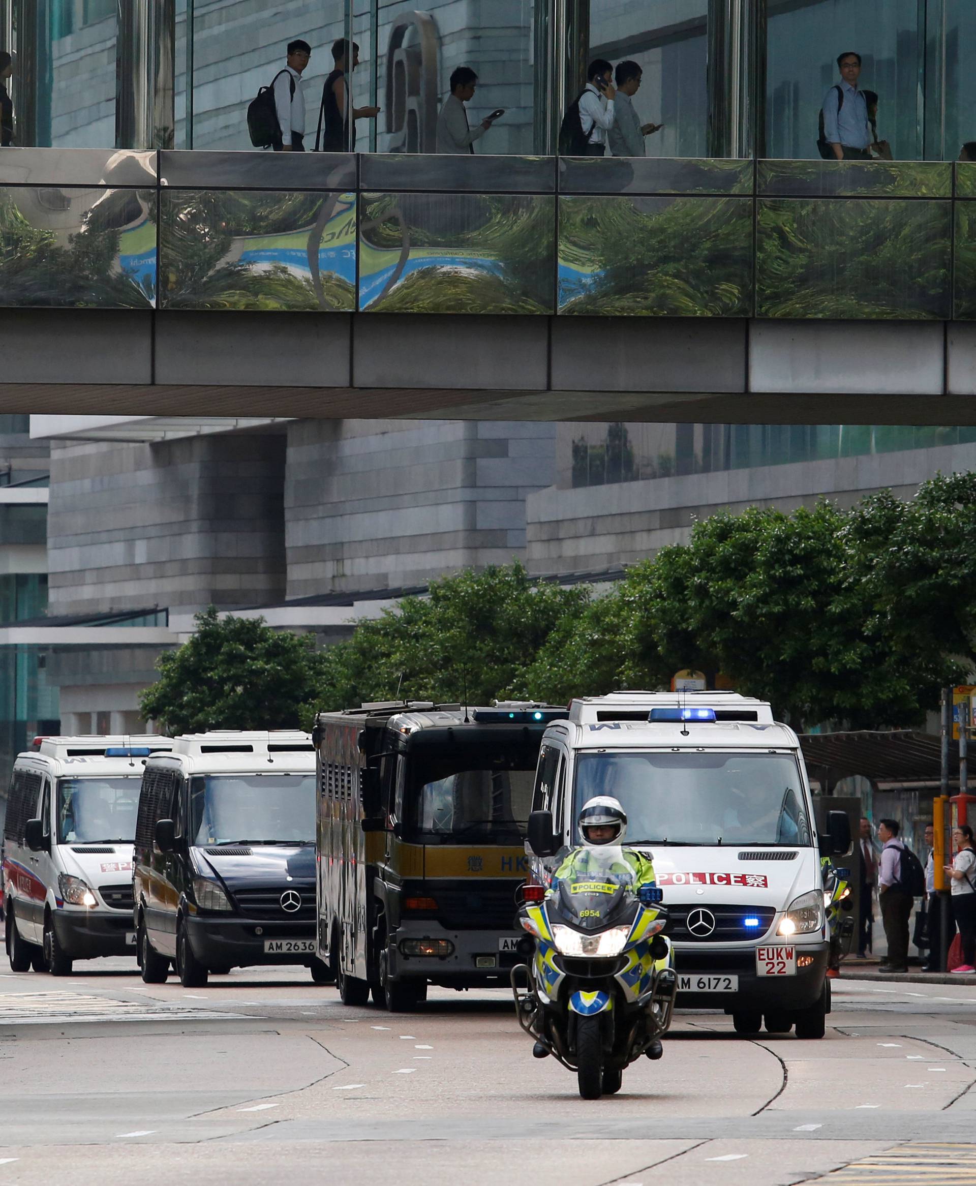 A motorcade taking British former banker Rurik Jutting to High Court in Hong Kong