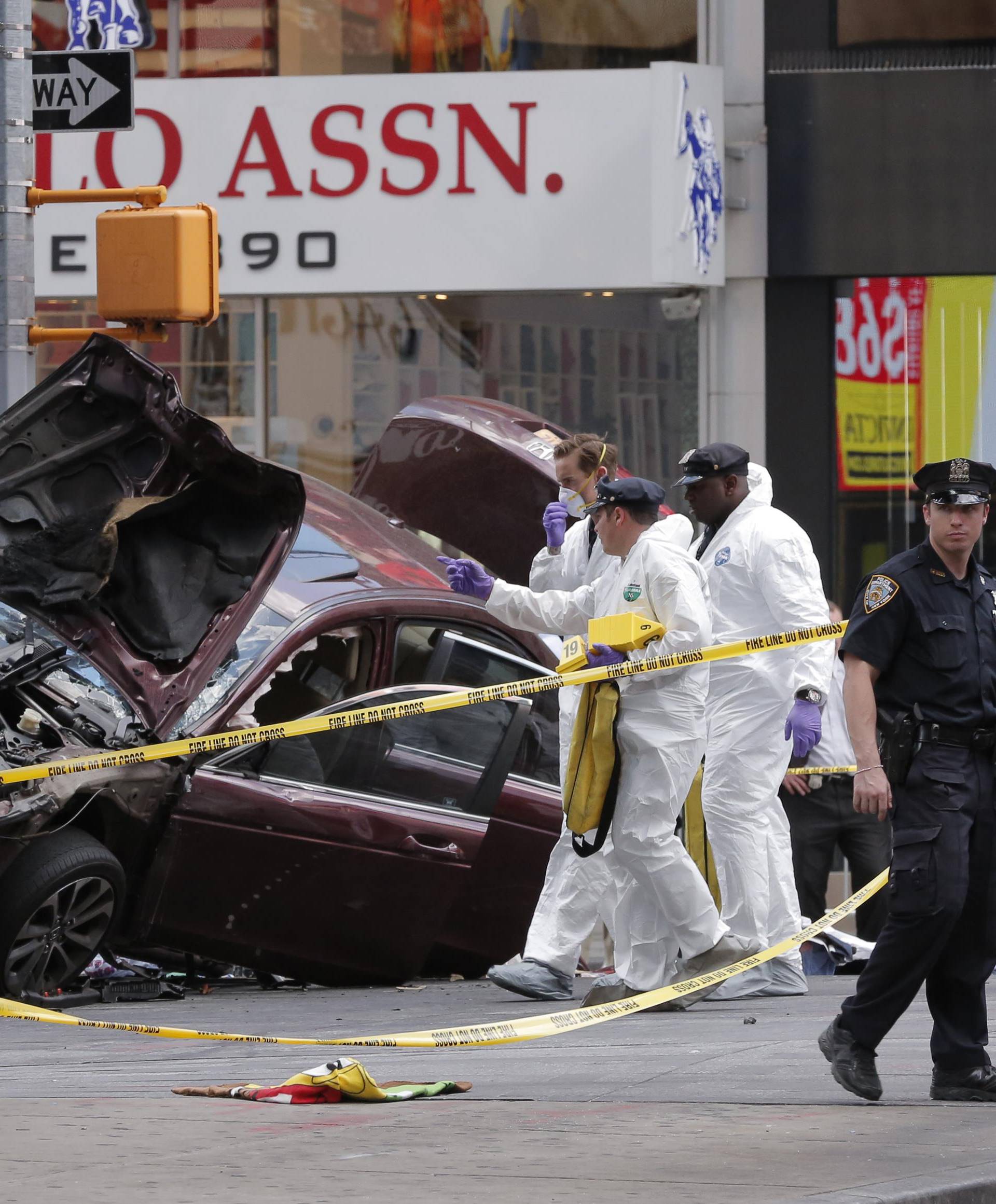 The remains of a vehicle involved in crash are cordoned off in Times Square in New York