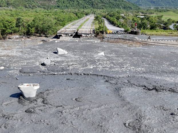 A drone view shows a collapsed bridge and flooded area, following Super Typhoon Ragasa, in Hualien
