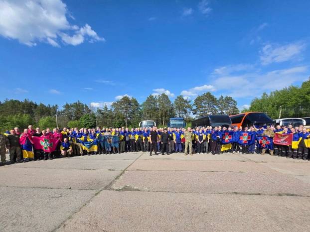 Ukrainian POWs are seen after a swap at an unknown location in Ukraine