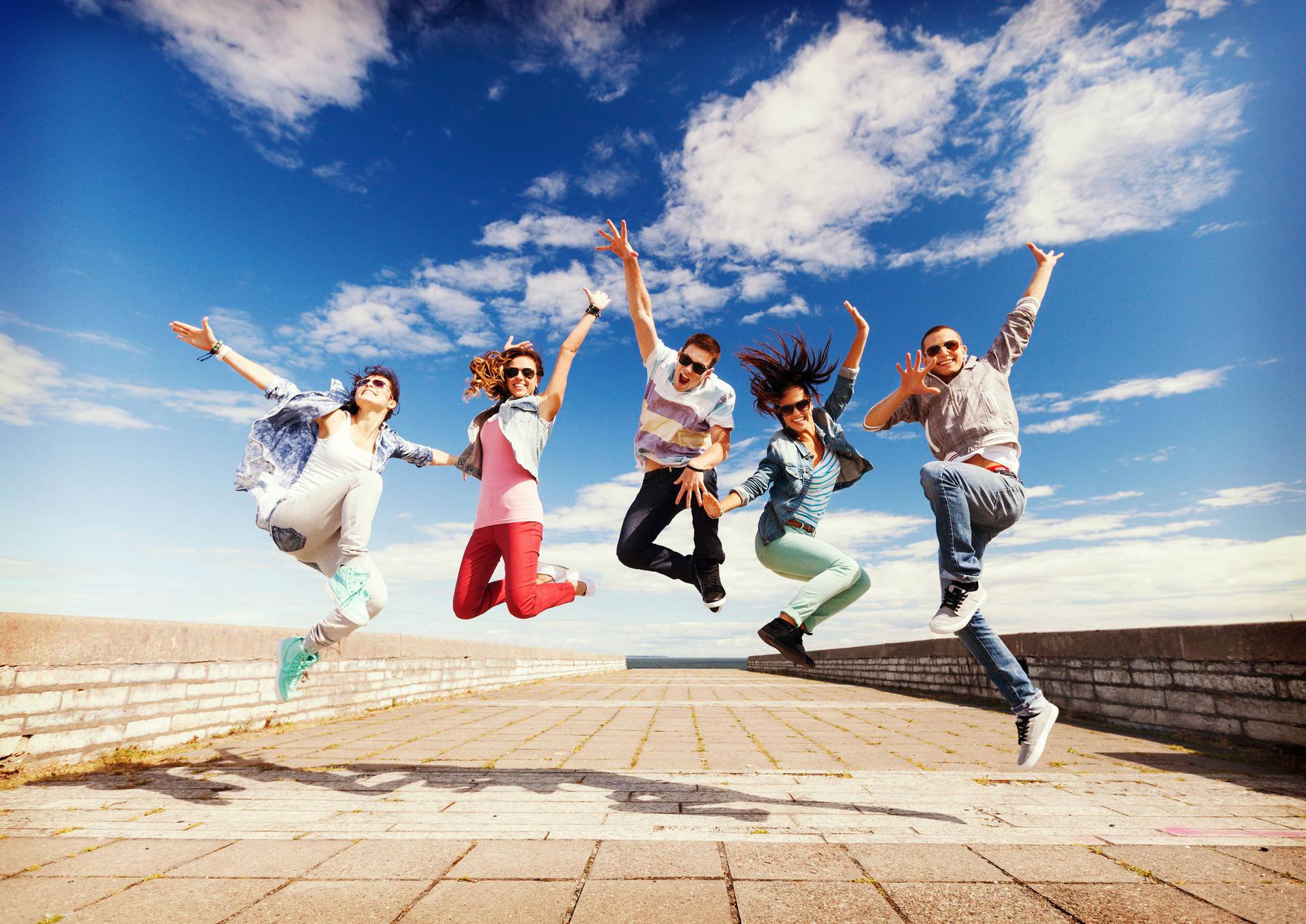 group of teenagers jumping