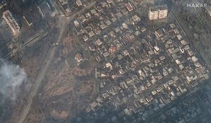 A satellite image shows destroyed homes and buildings in Mariupol