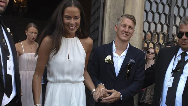 Manchester Utd and Germany National team player Bastian Schweinsteiger ties the know with his fiancee' Ana Ivanovic at Venice City Hall. NO ITALY NO GERMANY