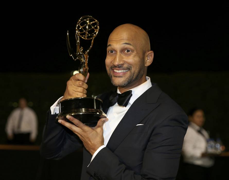 Keegan-Michael Key holds the award for Outstanding Variety Sketch Series as he arrives at the Governors Ball after the 68th Primetime Emmy Awards in Los Angeles