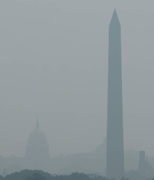 Smoke from Canadian wildfires clouds the National Mall and monuments in Washington