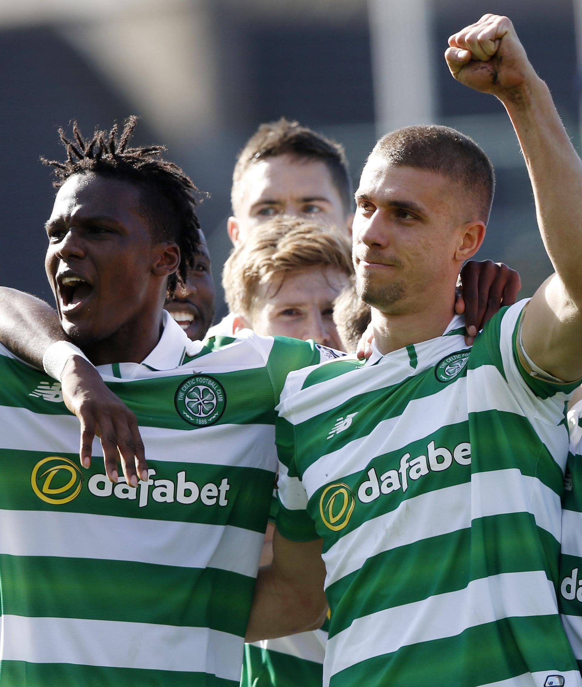 Celtic's Jozo Simunovic celebrates scoring their first goal with Dedryck Boyata