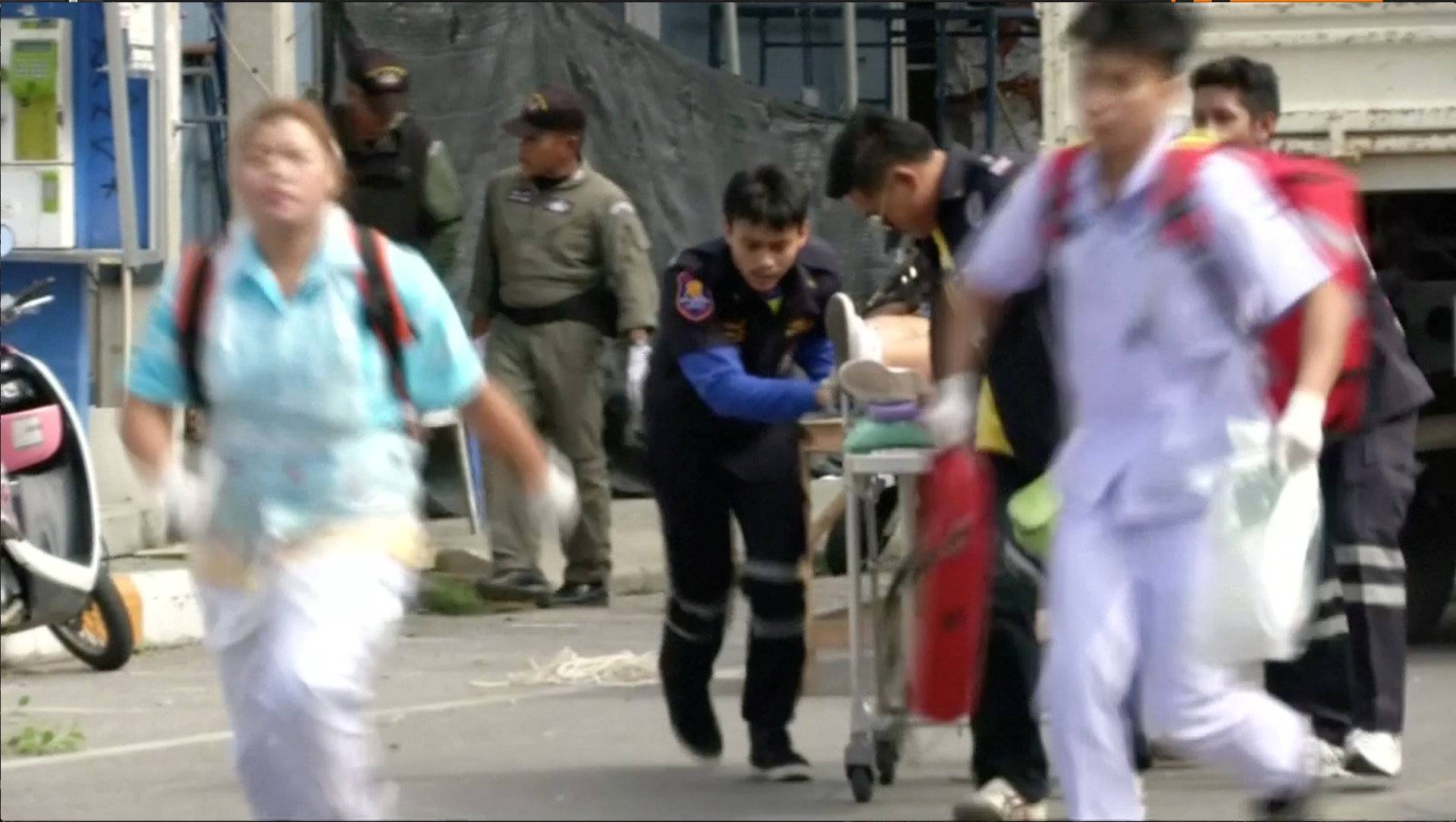 Rescuers and medical officers push an injured person on a gurney at the site of a bomb blast in Hua Hin, south of Bangkok