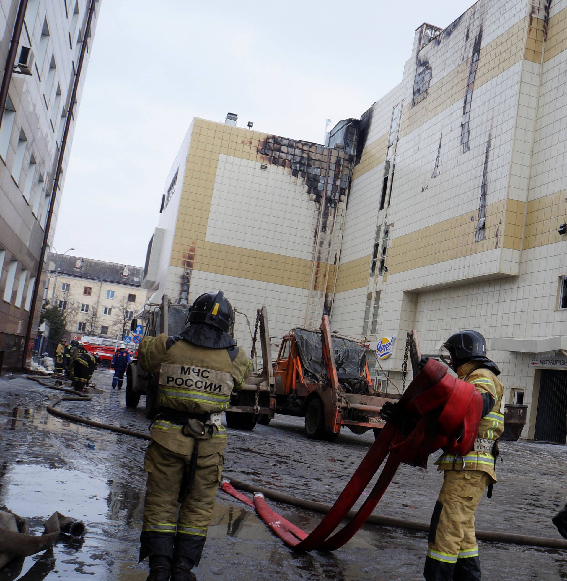 Members of the Emergency Situations Ministry work to extinguish a fire in a shopping mall in Kemerovo