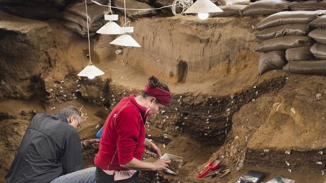 Researchers work inside Blombos Cave on South Africa's southern coast