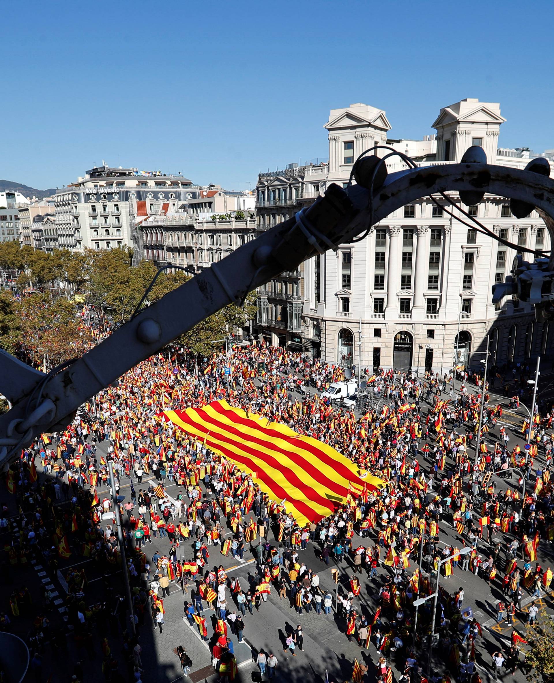 Pro-unity supporters take part in a demonstration in central Barcelona