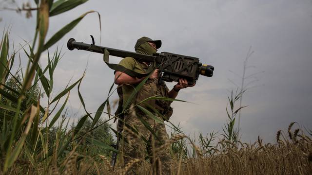 Ukrainian serviceman holds a Stinger anti-aircraft missile at a position in a front line in Mykolaiv region