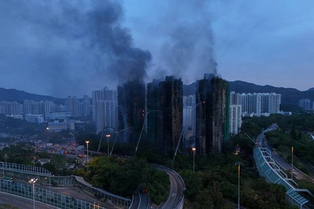 A drone view shows flames and thick smoke rising from Wang Fuk Court housing estate during a major fire, in Tai Po, Hong Kong