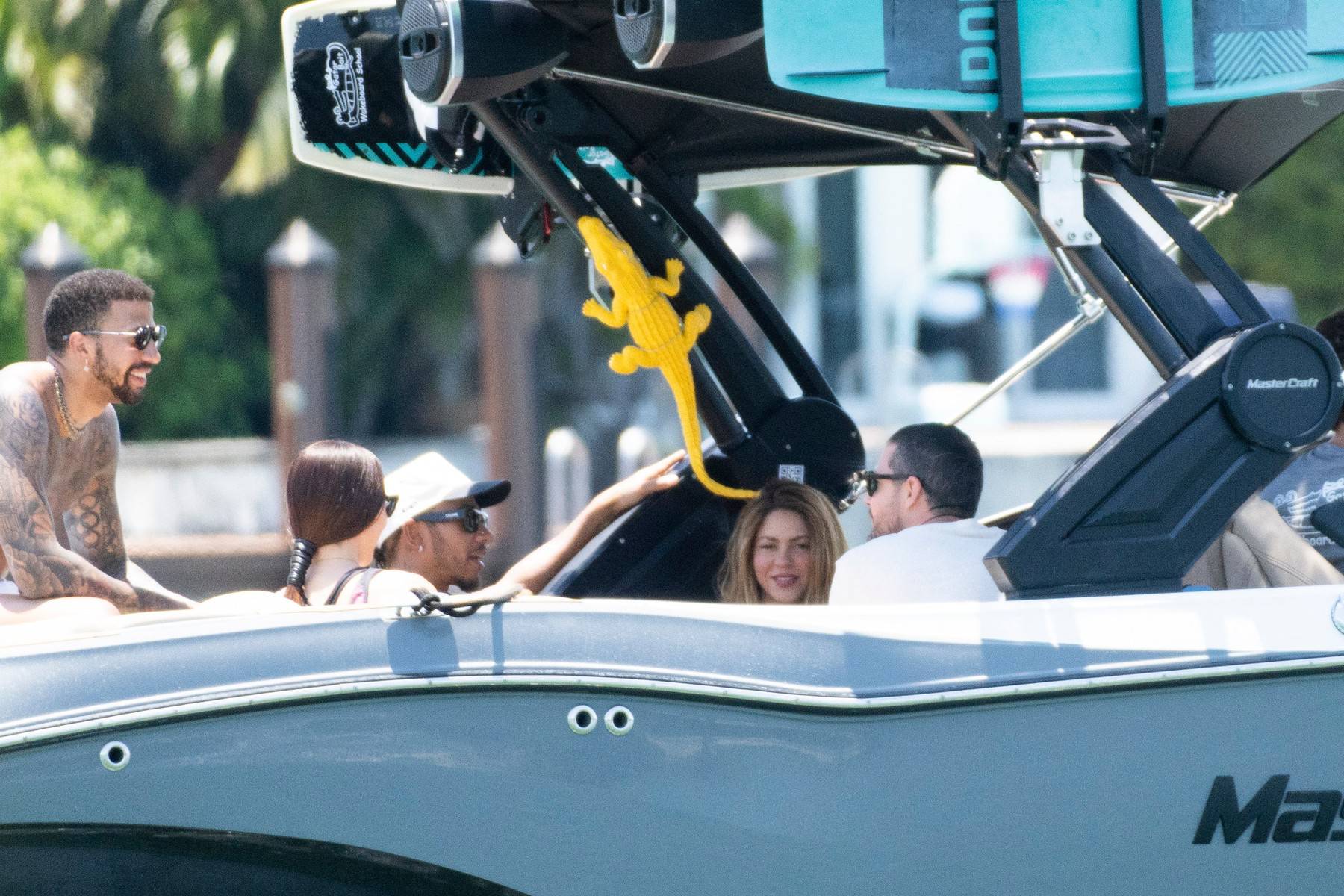 Shakira sparks new romance rumors as she enjoys Miami boat trip with F1 megastar Lewis Hamilton hours after the pair crossed paths at a fancy restaurant.