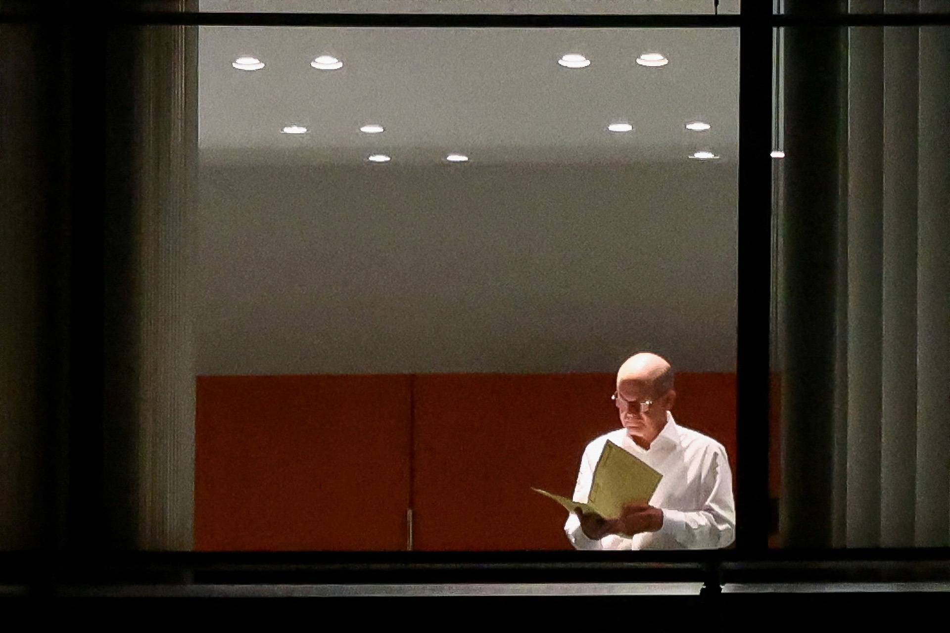 German Chancellor Scholz is seen in the Chancellor's office before a coalition meeting, in Berlin