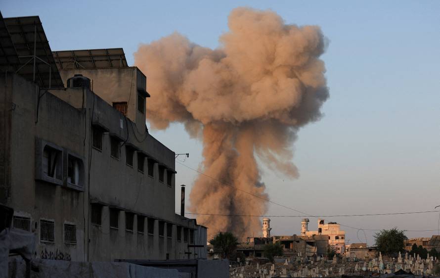 Smoke rises following an explosion during an Israeli operation, in Gaza City