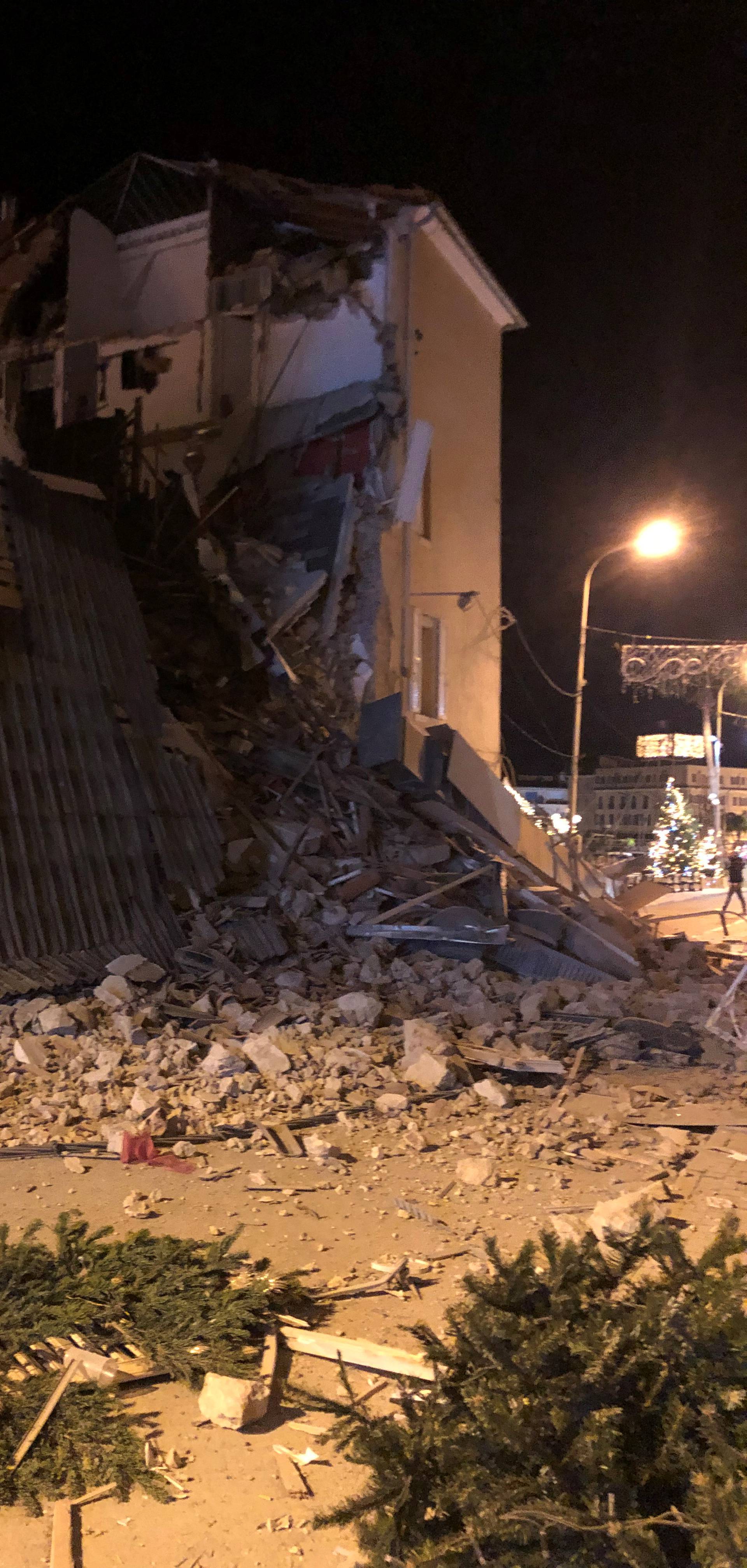 Debris lies on the street after a building collapsed in Sanary-sur-Mer