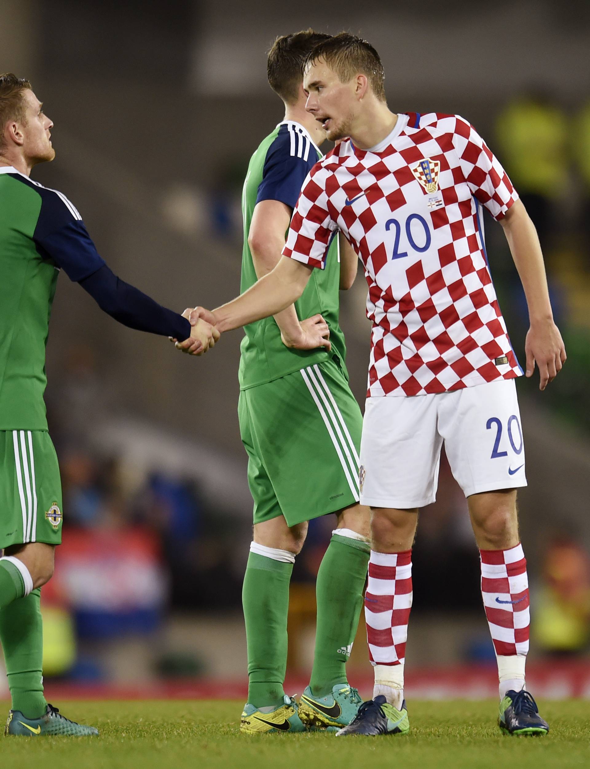 Northern Ireland's Steven Davis shakes hands with Croatia's Filip Bradaric after the match
