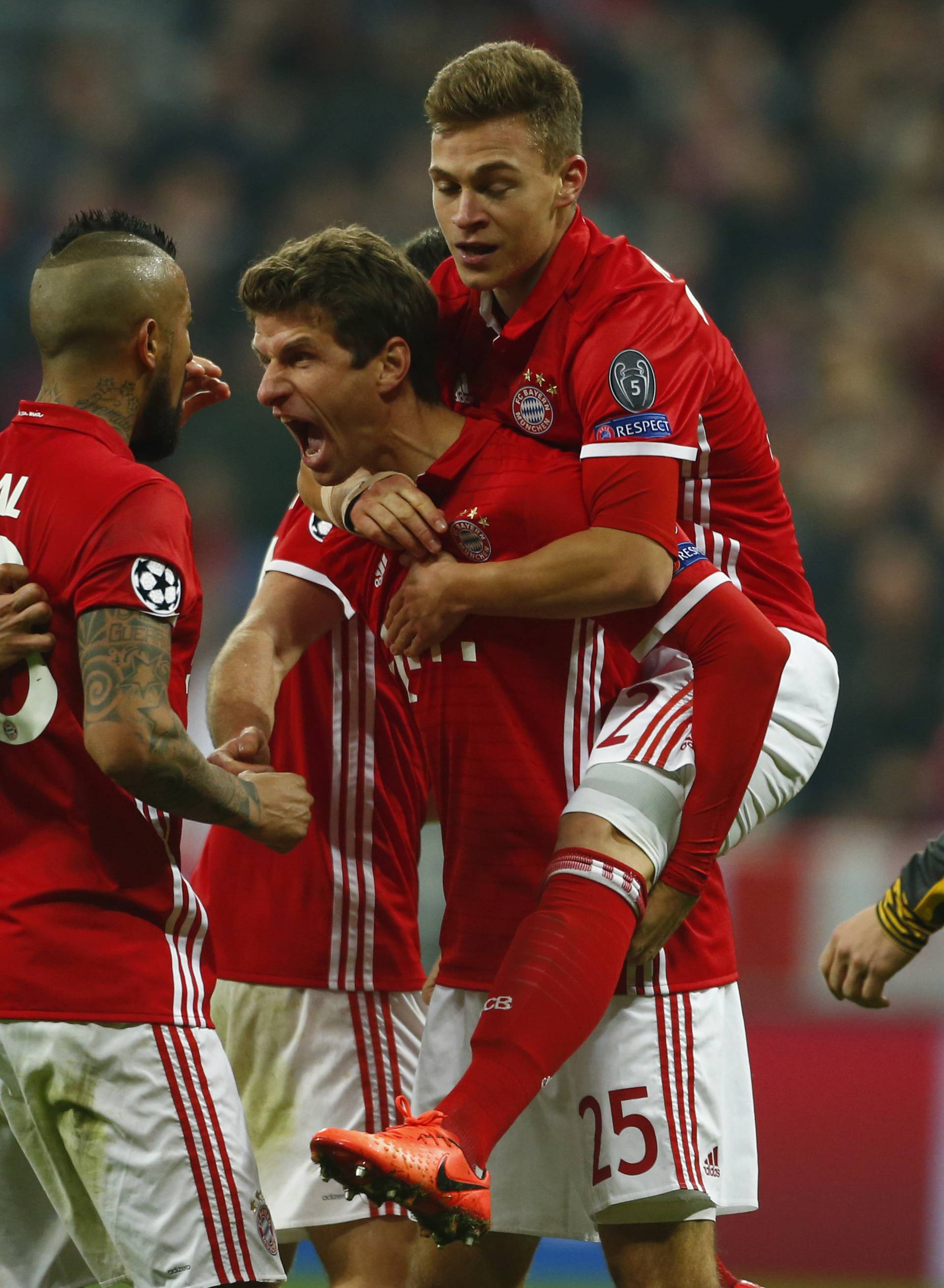 Bayern Munich's Thomas Muller celebrates scoring their fifth goal with teammates
