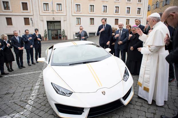 Pope Francis blesses a Lamborghini Huracan prior to his Wednesday general audience in Saint Peter