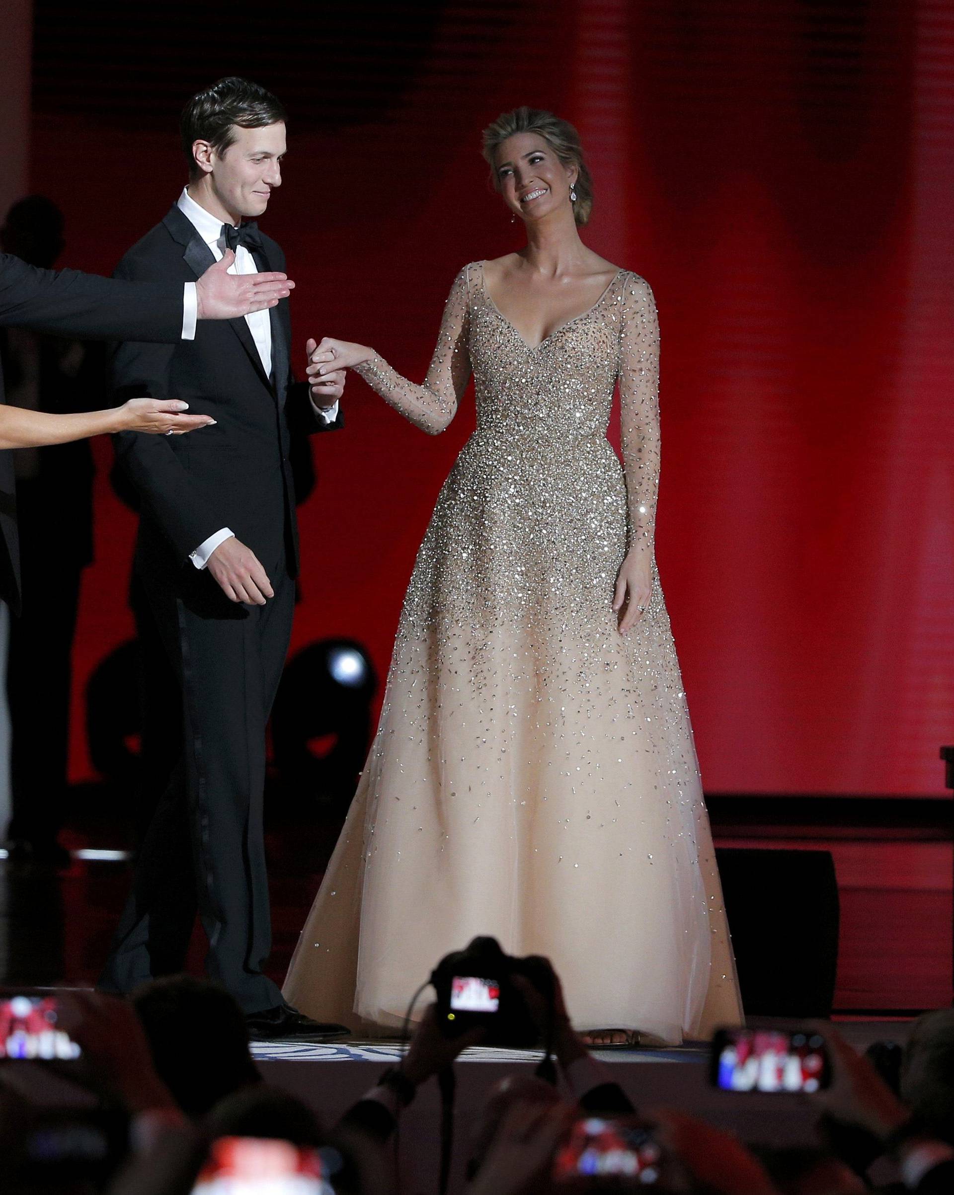 U.S. President Donald Trump and his wife first lady Melania Trump gesture towards his daughter Ivanka and her husband Jared Kushner at his "Liberty" Inaugural Ball in Washington