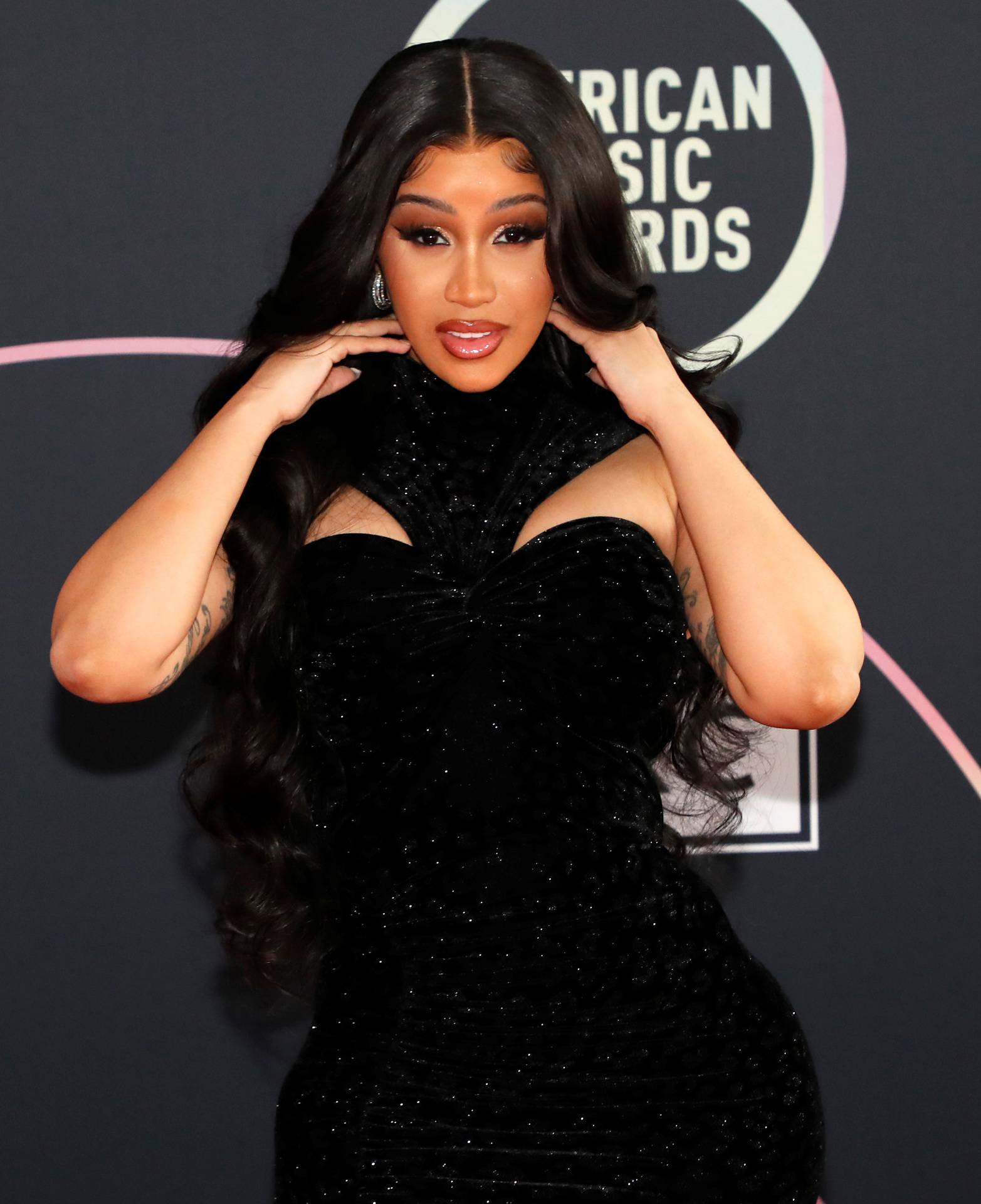 Show host Cardi B poses at a photo op ahead of the 49th Annual American Music Awards in Los Angeles