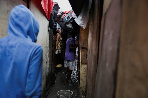 Haitians shelter from Hurricane Melissa's rains at church housing people displaced by gang violence, in Port-au-Prince