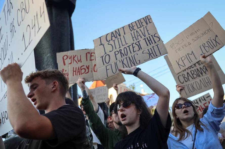 Ukrainians protest against a newly passed law, which curbs independence of anti-corruption institutions in central Lviv