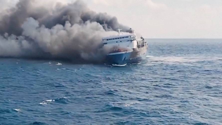 Plumes of smoke rise from a ferry which caught fire off Indonesia's Madura island