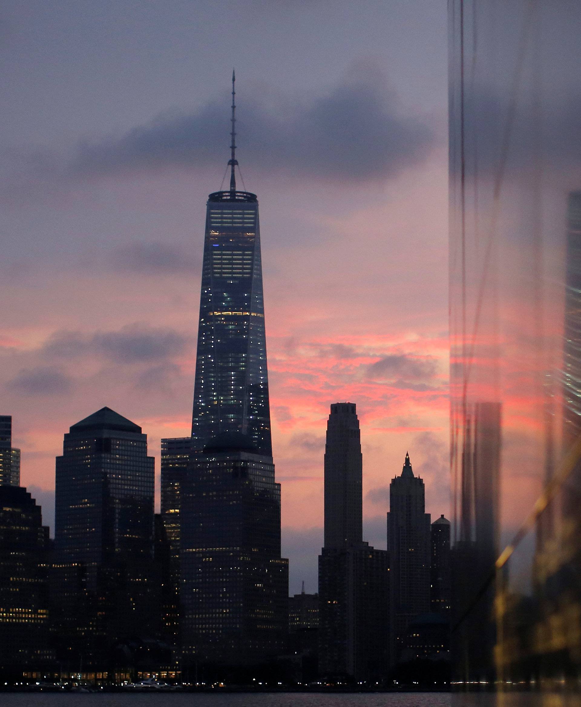 Lower Manhattan is reflected in the Empty Sky memorial on the morning of the 15th anniversary of the 9/11 attacks in New Jersey