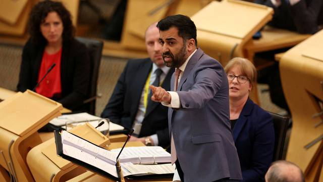 FILE PHOTO: Scotland's First Minister Humza Yousaf takes questions from lawmakers, in Edinburgh