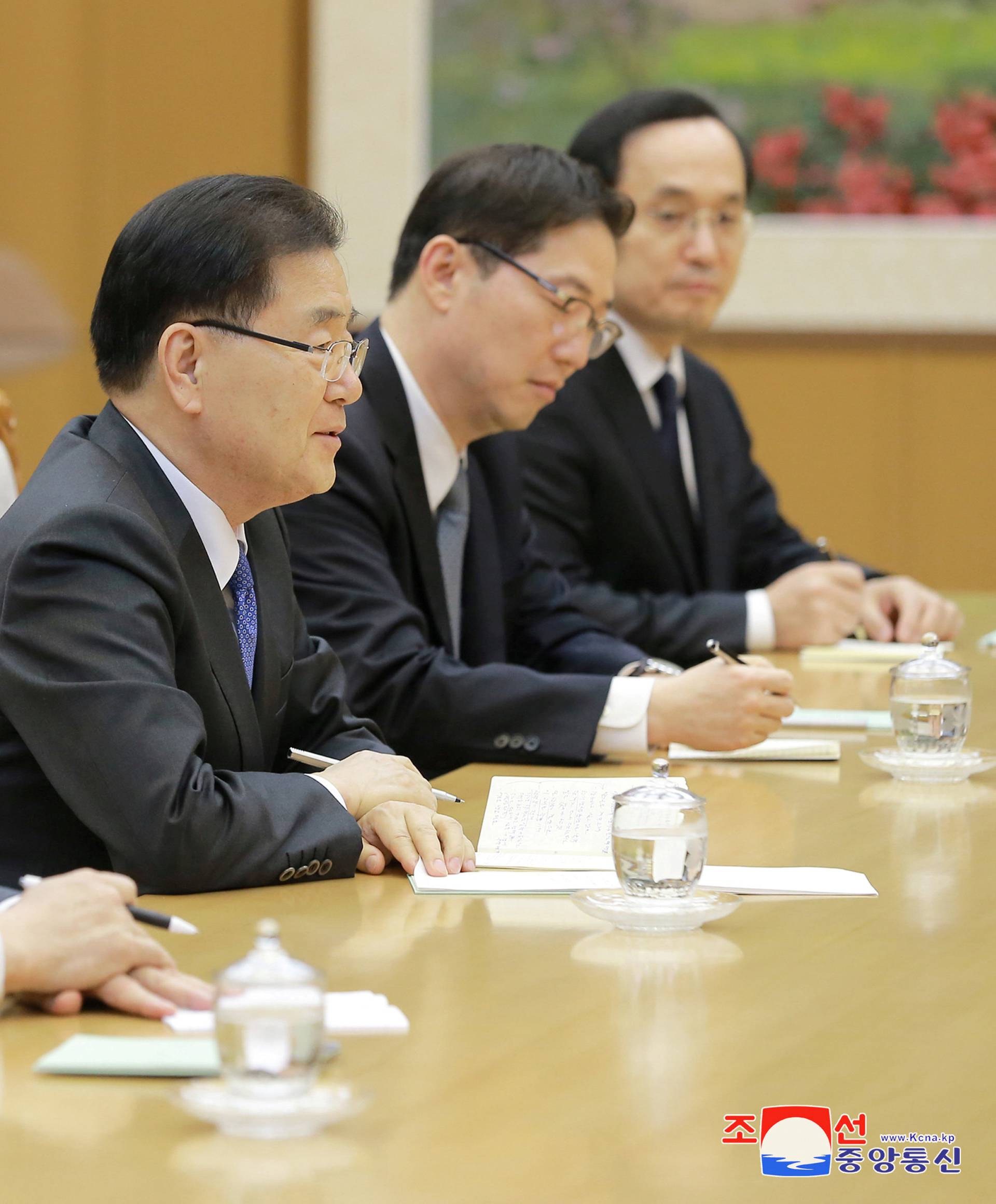 North Korean leader Kim Jong Un meets members of the special delegation of South Korea's President in this photo released by North Korea's Korean Central News Agency