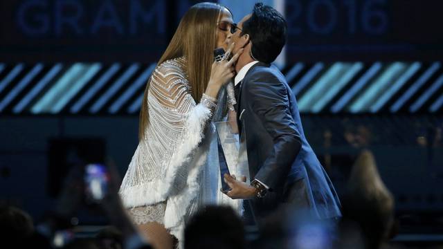 Lopez kisses Anthony after she presented him with award honoring him as Latin Recording Academy person of the year at the 17th Annual Latin Grammy Awards in Las Vegas