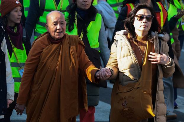 A group of Buddhist monks on the 2,300 mile “Walk for Peace” walk along Massachusetts Avenue at Embassy Row, in Washington